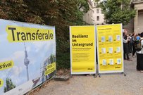 Transferale Plakat und Programm