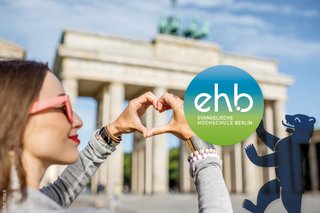 Young woman forming a heart with her hands in front of the Brandenburg Gate Berlin