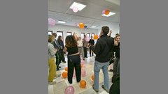 students taking part in game with air ballons